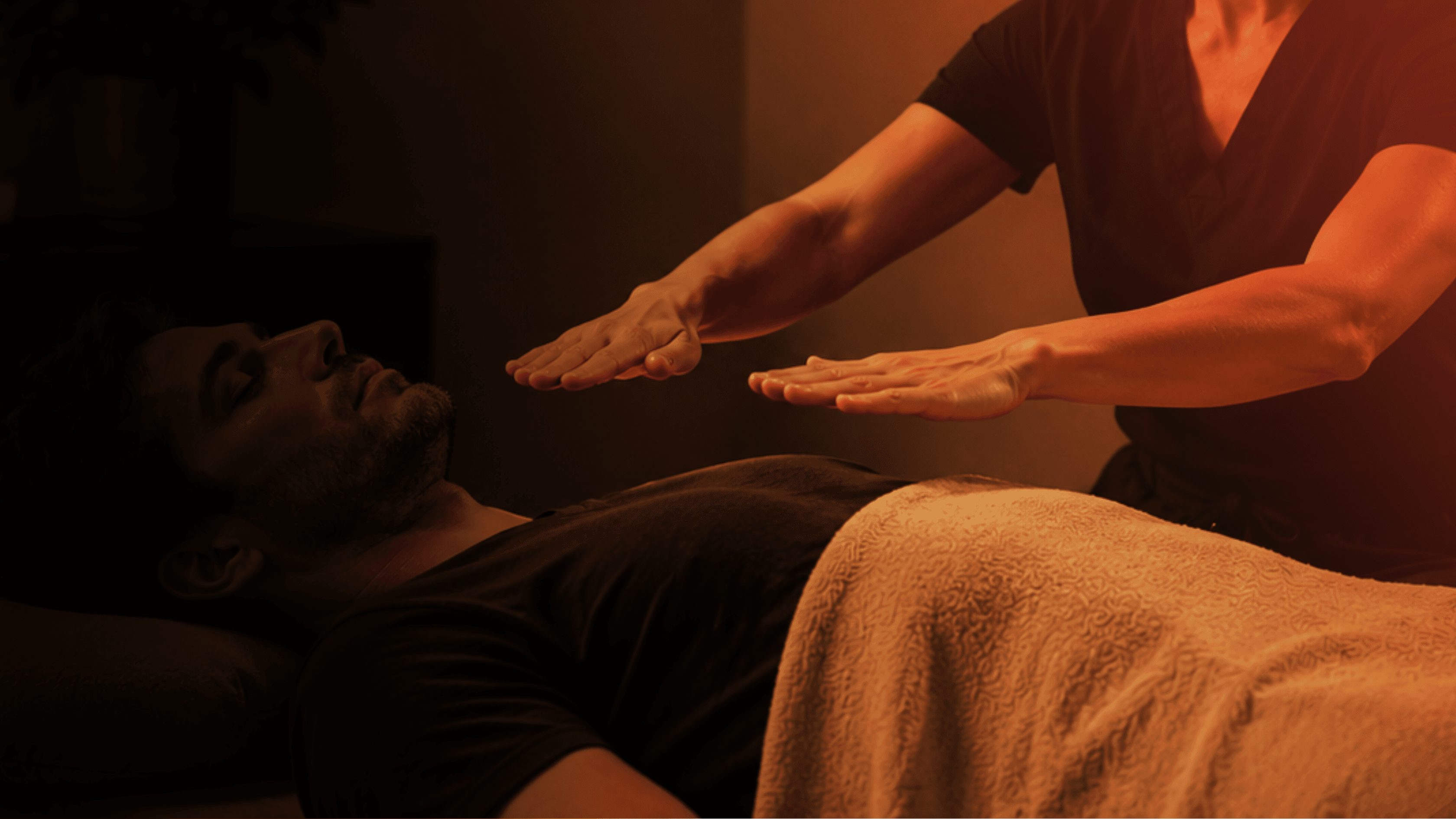 Reiki practitioner working in a calm treatment room